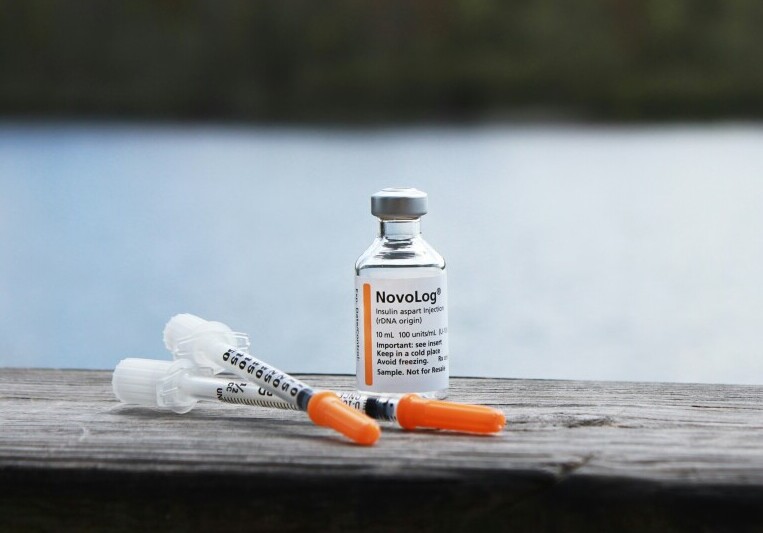 Insulin bottle and syringes